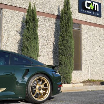 Charge Mods Sign with Forest Green Porsche 992 Turbo S in Dallas